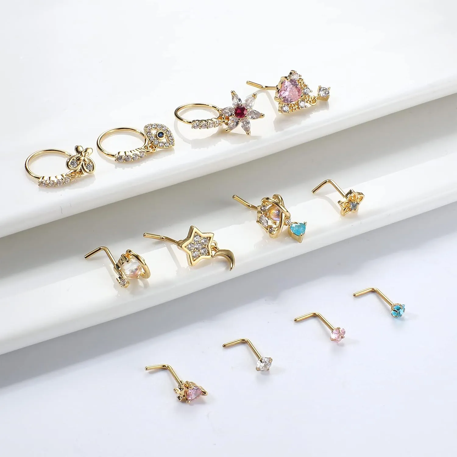 JOERICA 12 Pcs 20G Dangle Nose Rings and Studs for Women - L Shaped Stainless Steel Hoops With Butterfly, Heart, Moon, Flower, Evil Eye, Crown CZ Dangling Piercing Jewelry